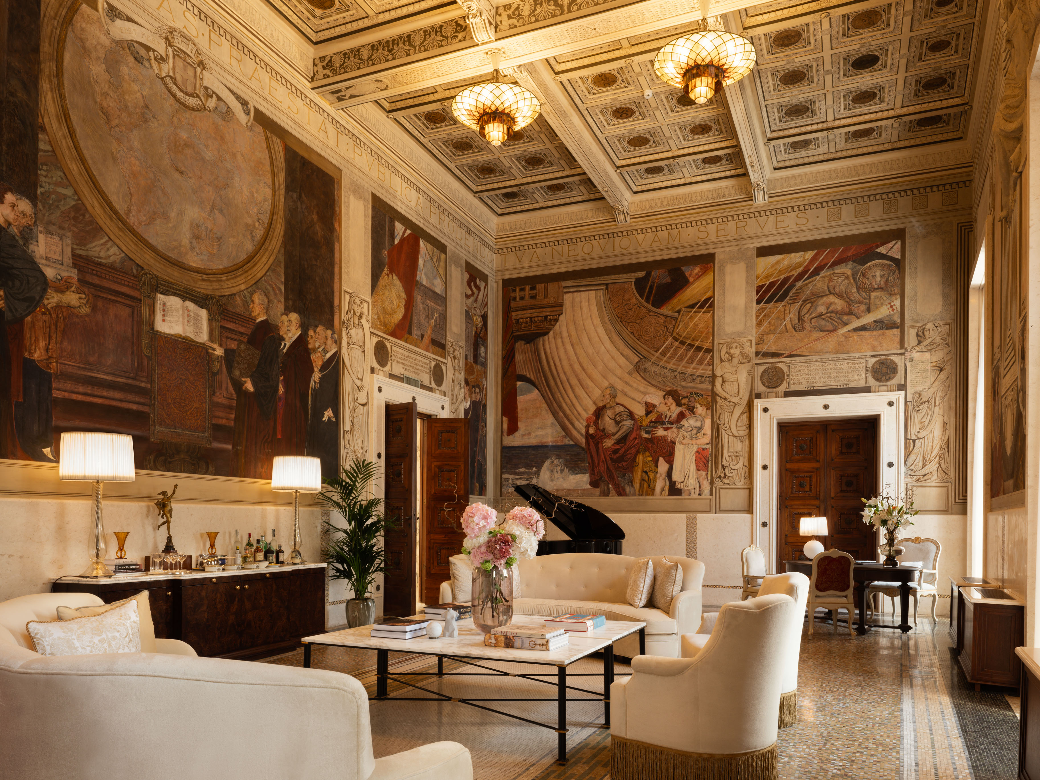 Theodoli Heritage Suite at Corinthia Rome: doors open to grand living space