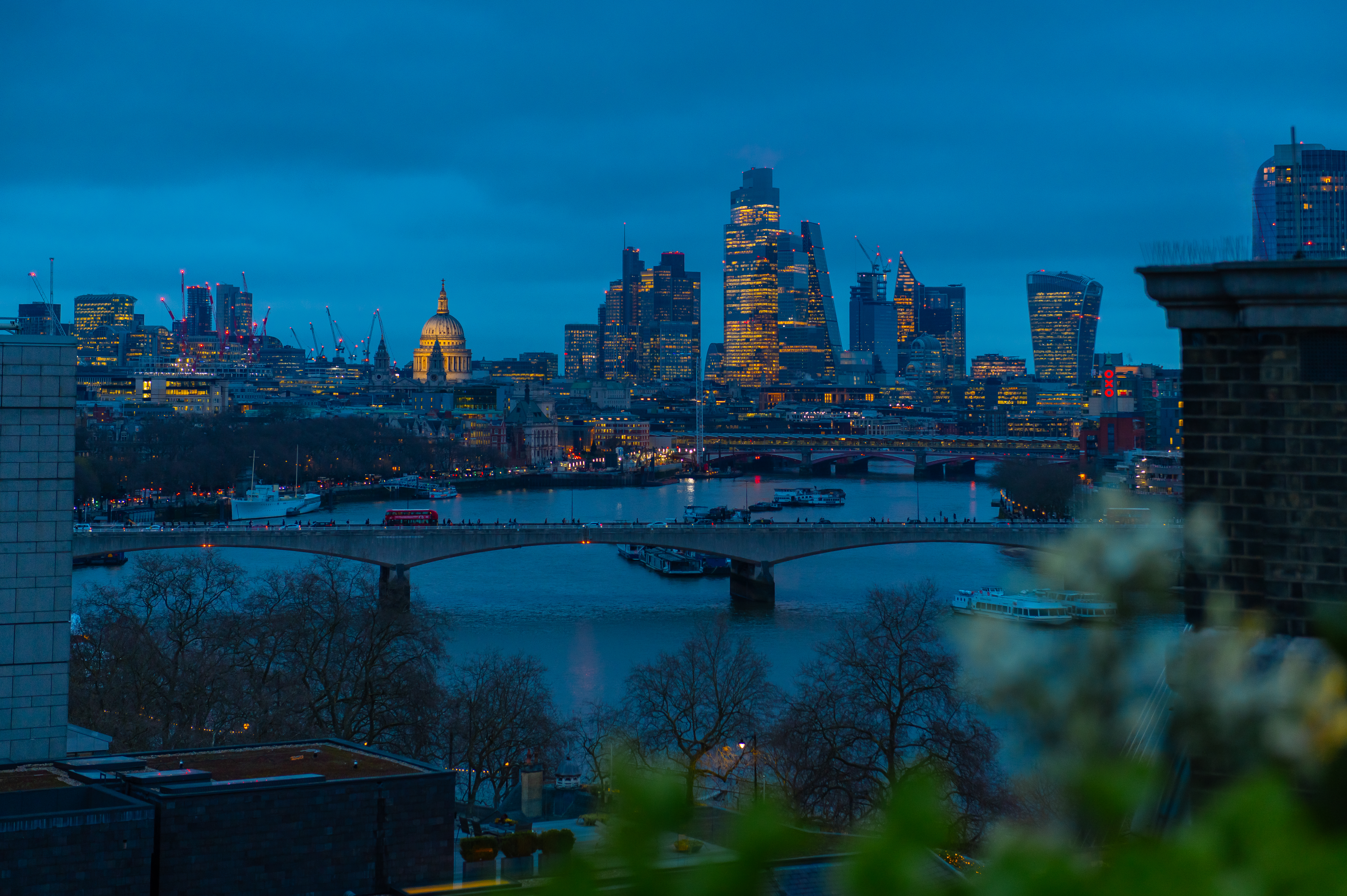 City of London skyline in the evening with illuminated buildings
