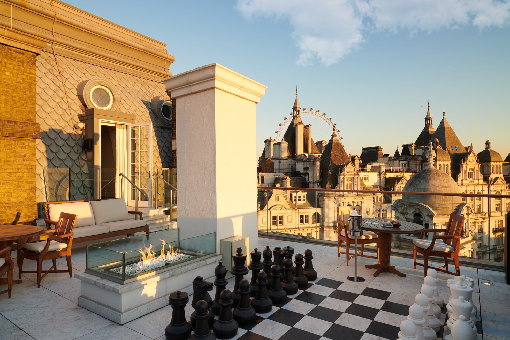 Whitehall Penthouse terrace at Corinthia London luxury hotel featuring giant chessboard with Southbank in the distance