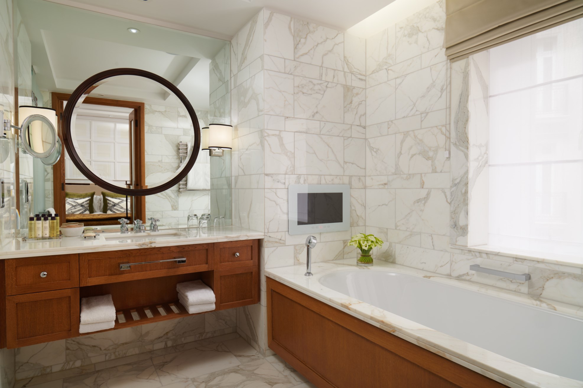 Bathroom with double marble sink and bathtub