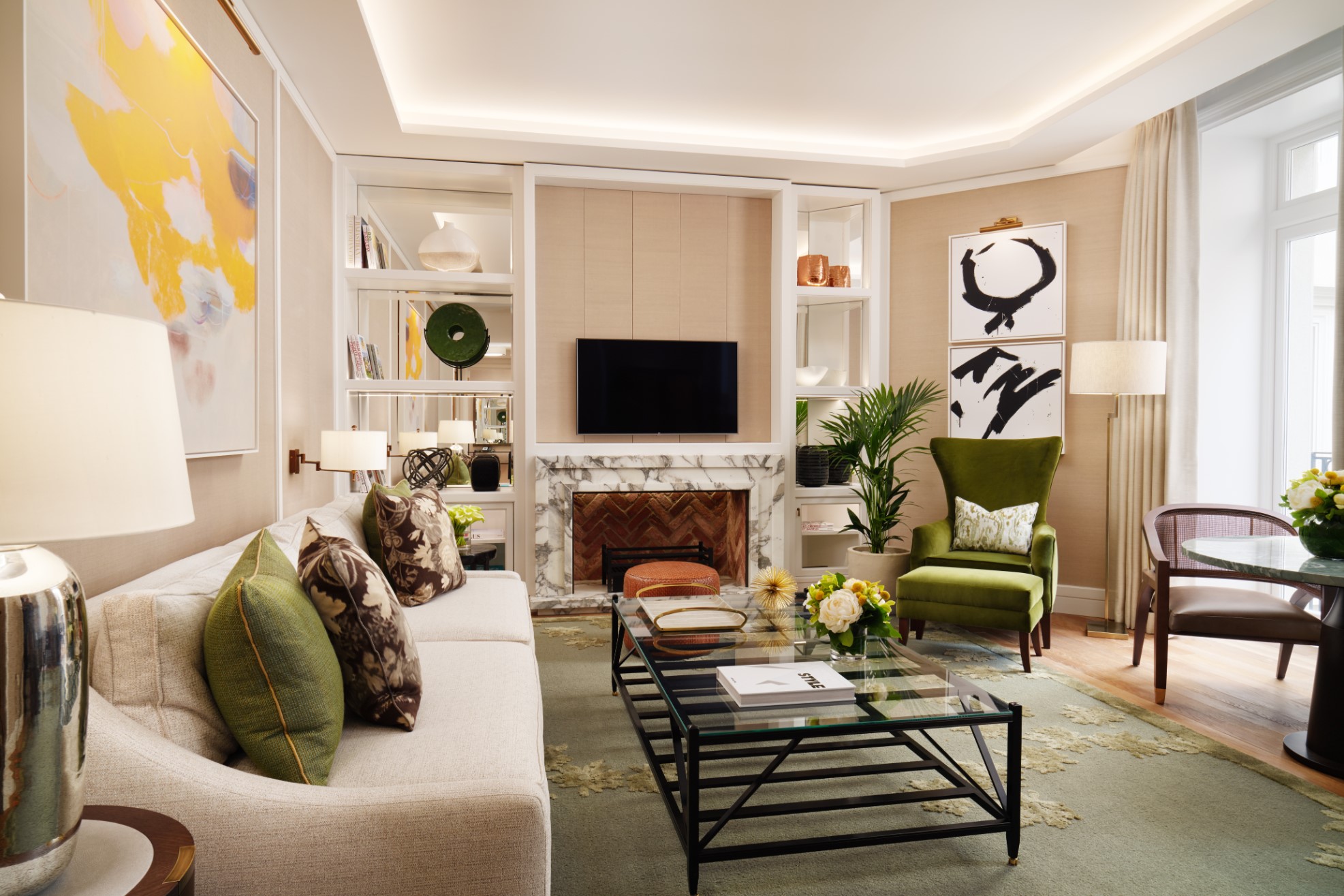 Garden Suite living room with sofa, table, chair and fireplace