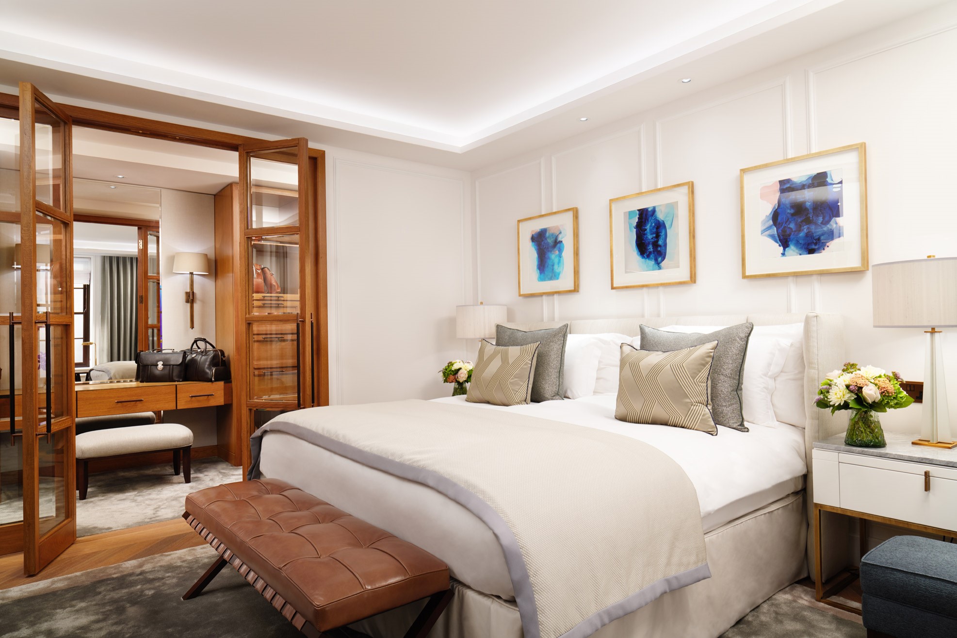 Bedroom with doors into a walk-in wardrobe