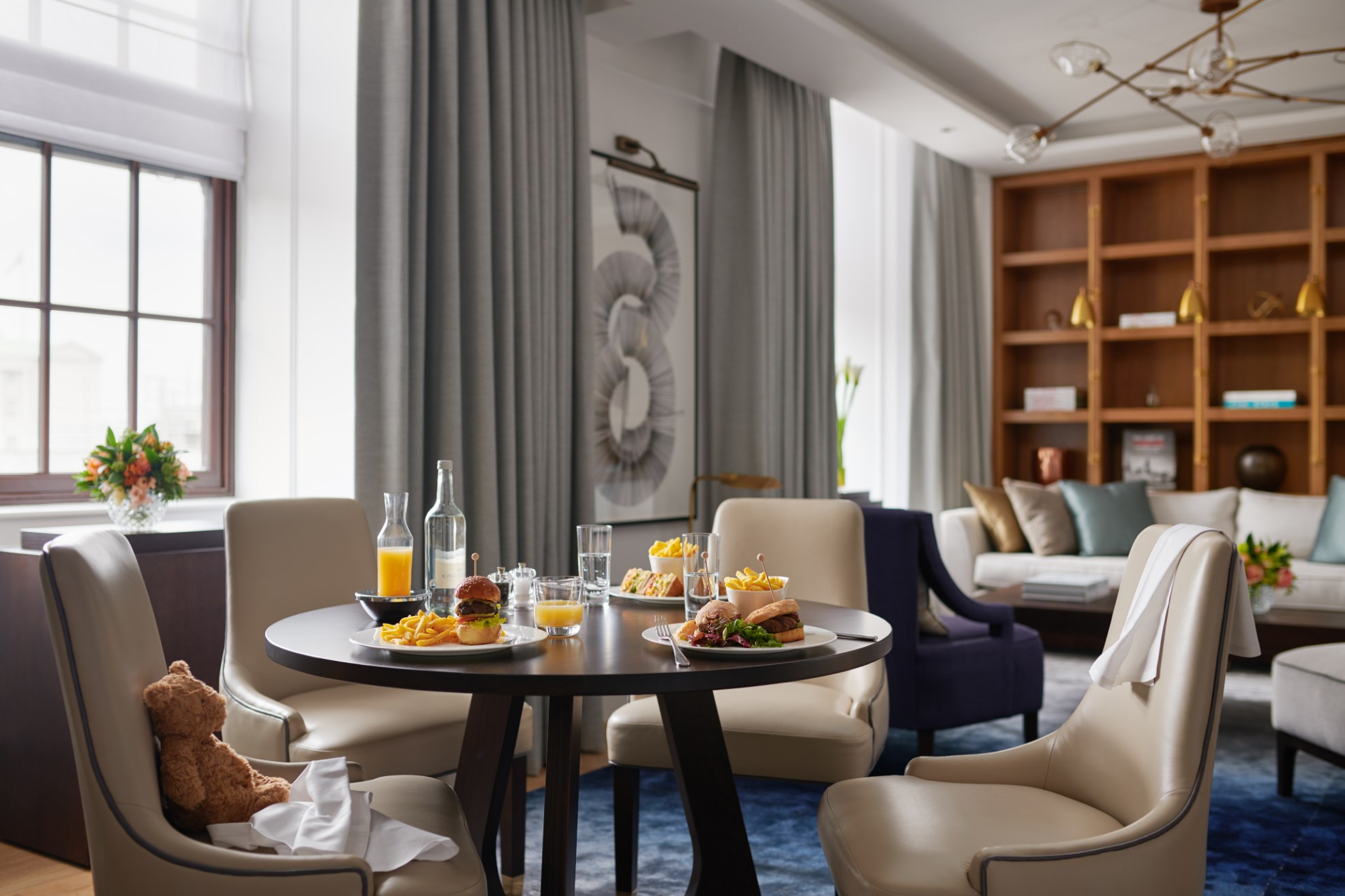 Dining area with plates of food on the table