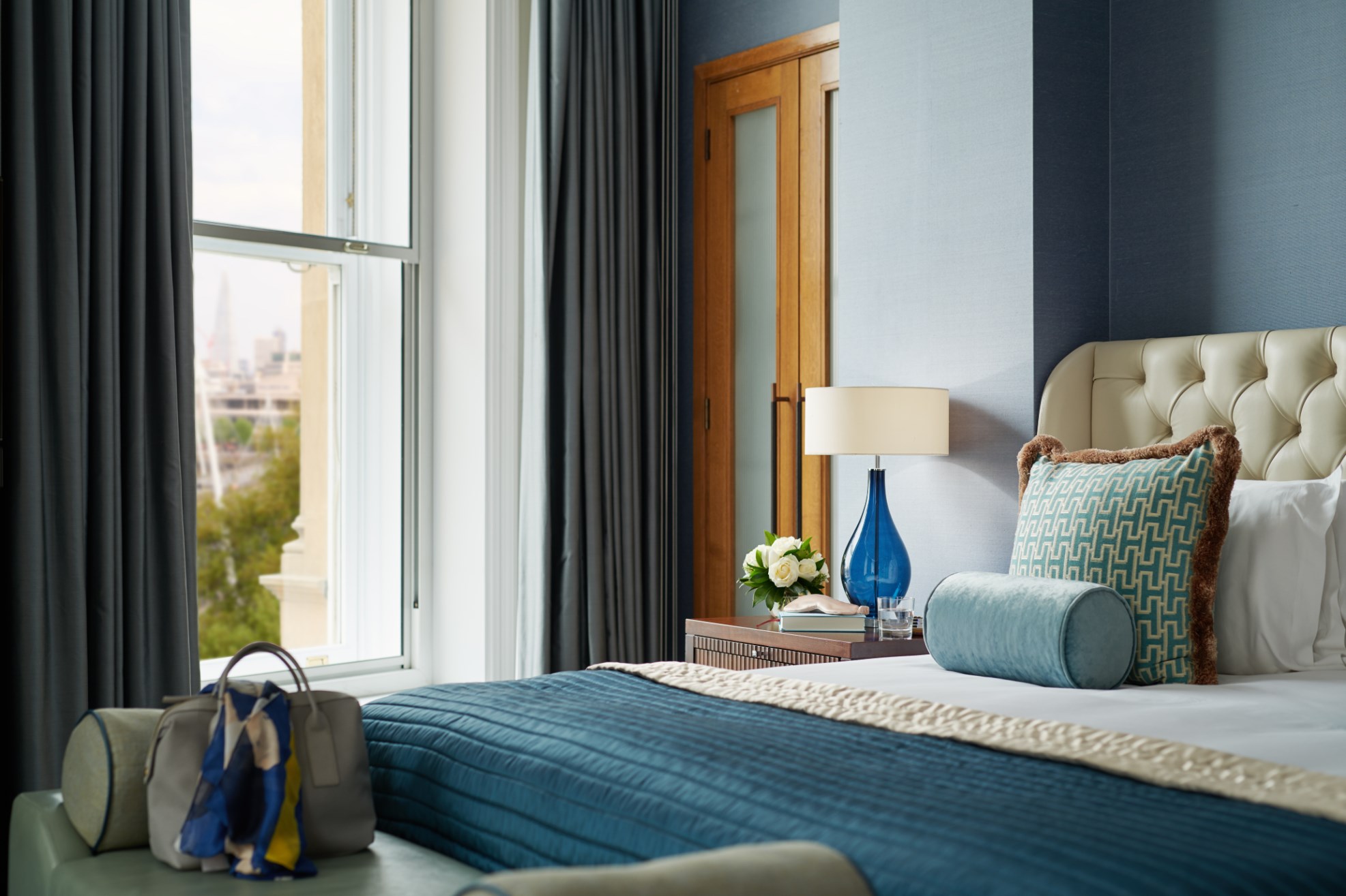Bedroom in Luxury Suite at Corinthia London, with a River Thames window view.
