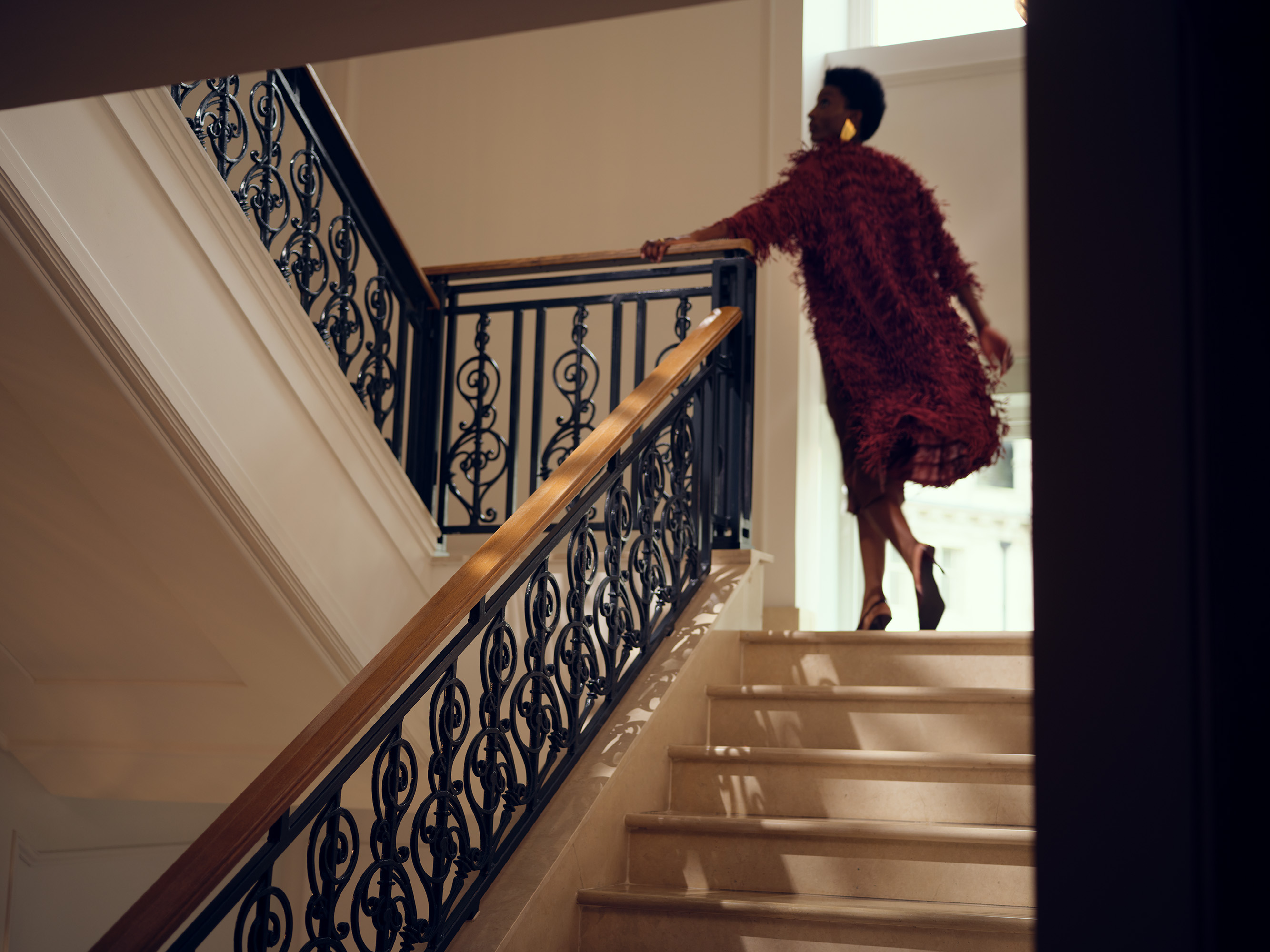 Elegant staircase with ornate black railings at Corinthia London five-star luxury hotel