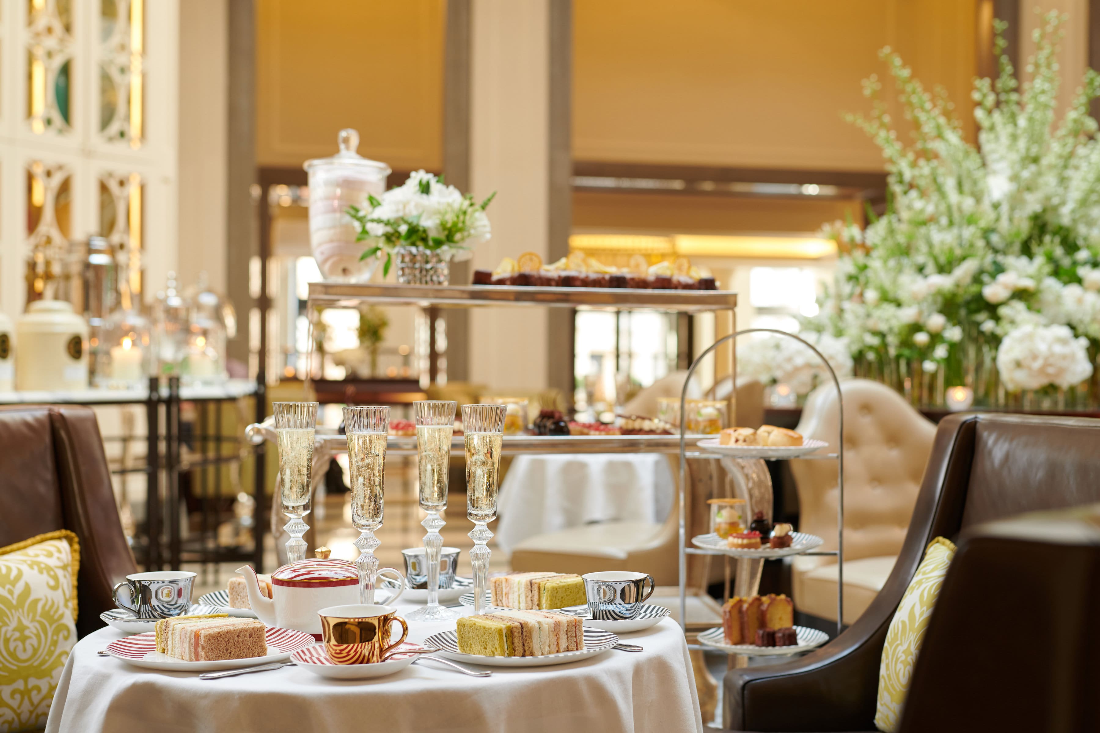 Luxury afternoon tea experience with champagne in the Crystal Moon Lounge, Corinthia London.