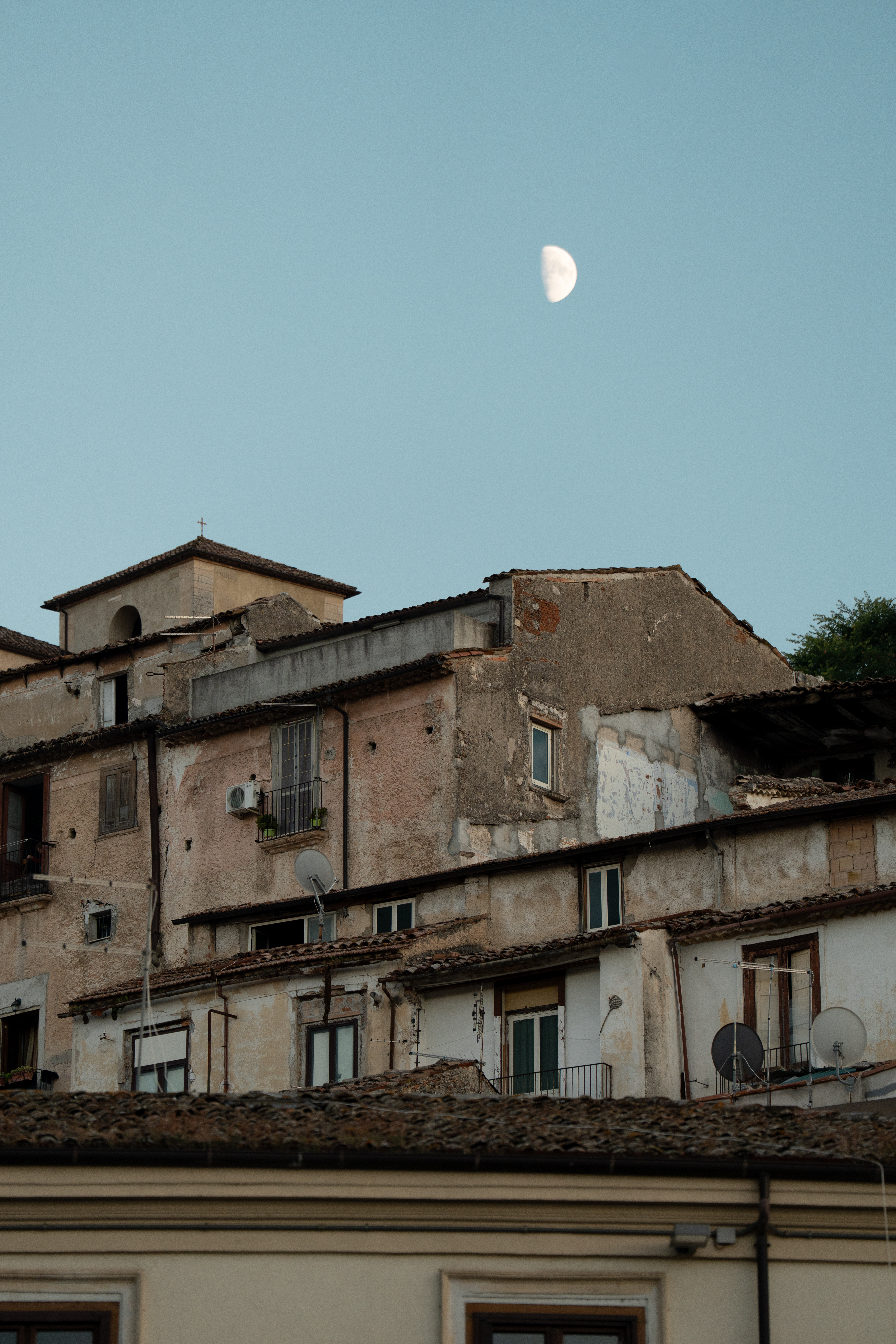 Southern Italian architecture at dusk under the moon, inspiration for Mezzogiorno at Corinthia London