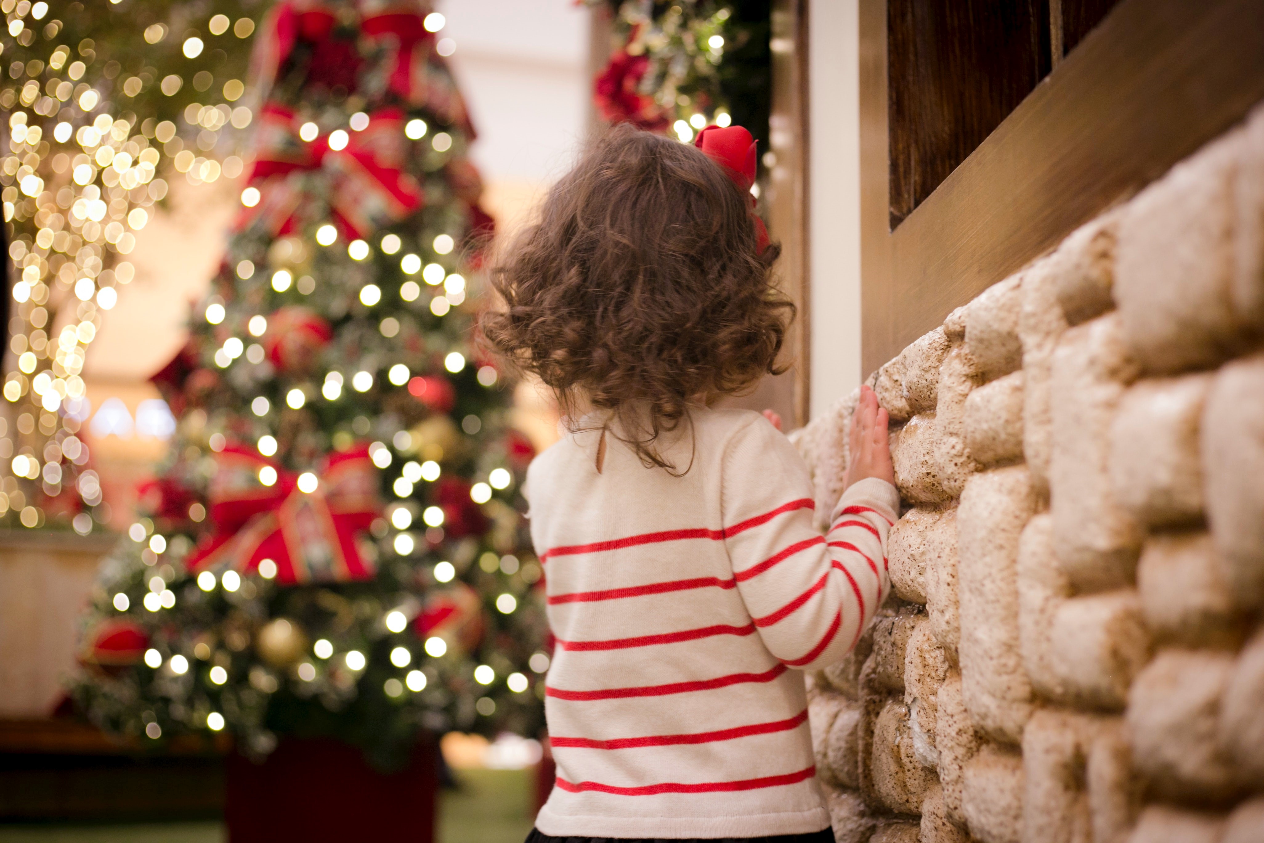 Little girl in front of Christmas tree 