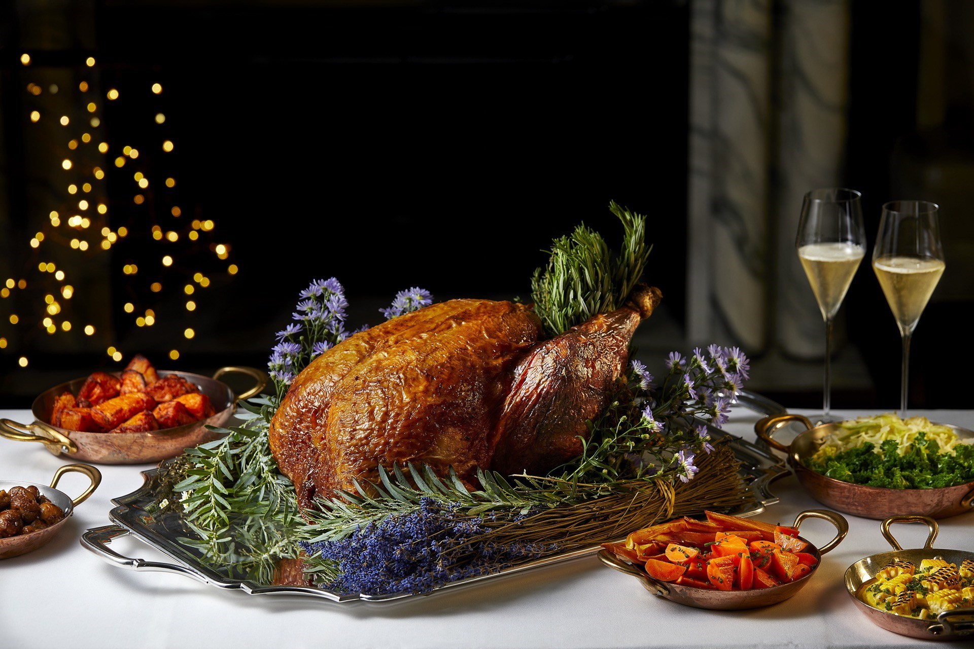Festive turkey with all the trimmings and glasses of Champagne