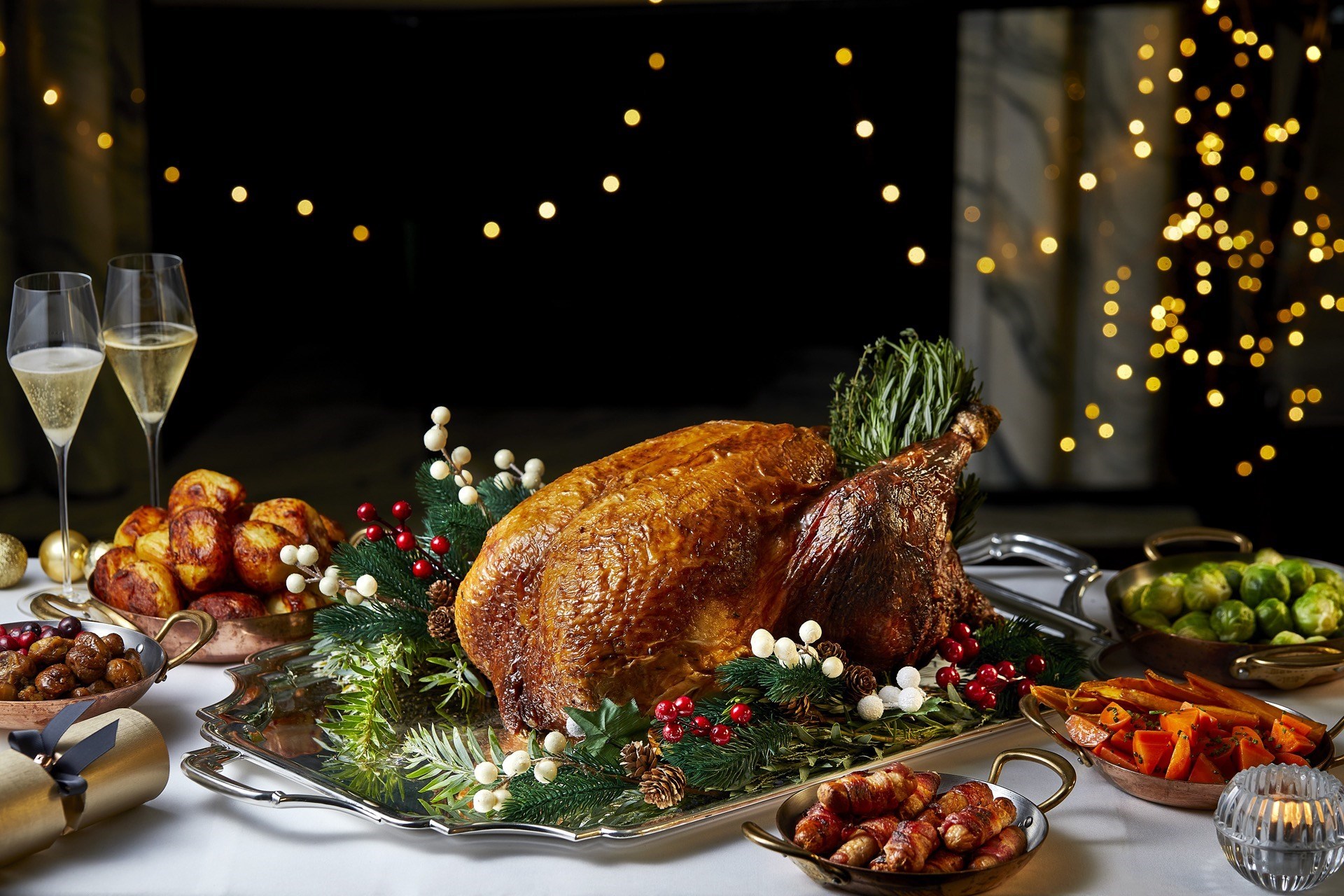 Festive turkey with all the trimmings and glasses of Champagne