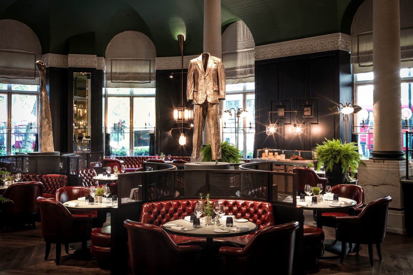 Artistic sculpture paired with stylish seating in Kerridge’s, creating a sophisticated dining ambiance.