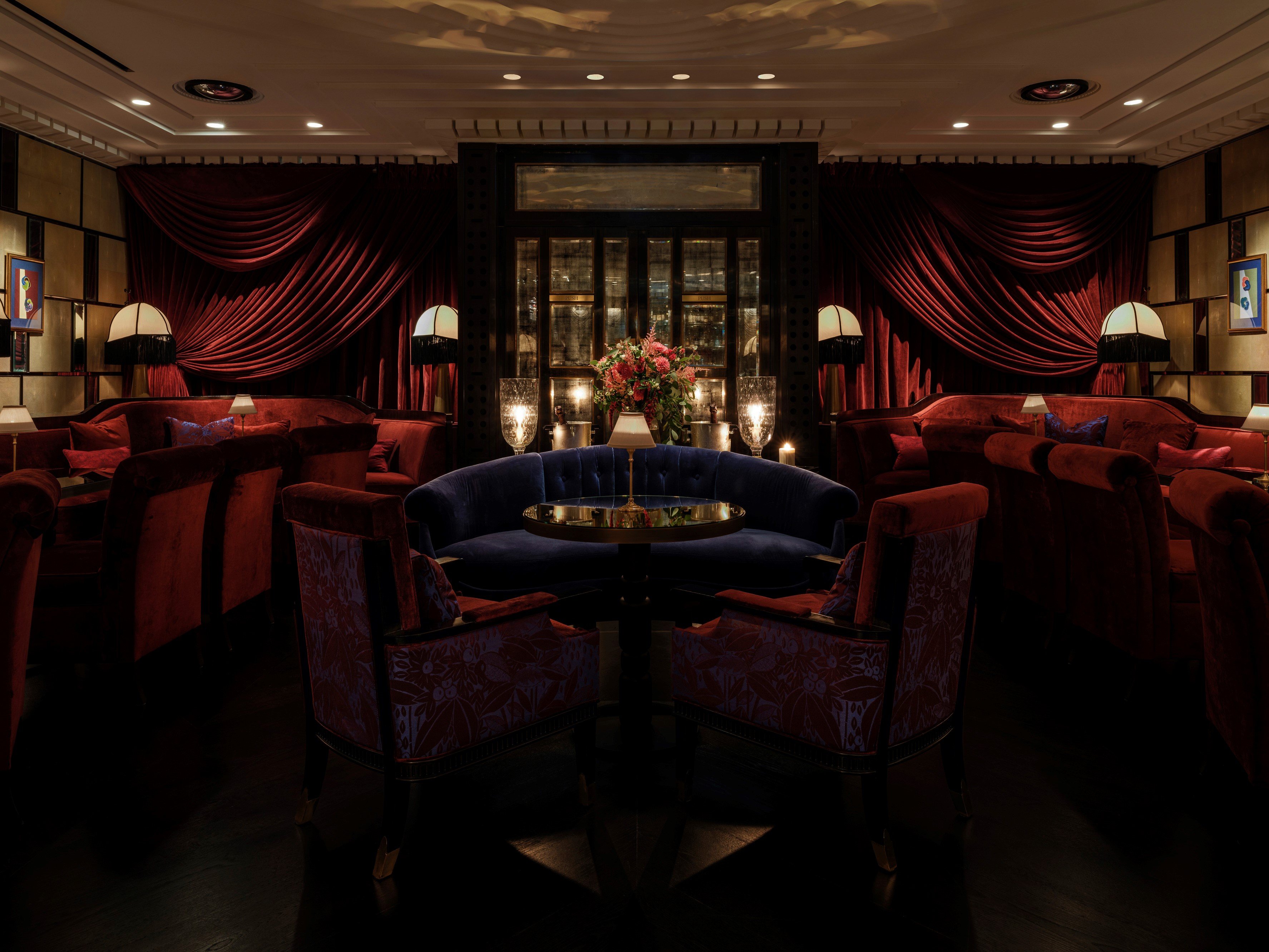 Vibrant red and blue interior design of Velvet by Salvatore Calabrese featuring modern décor and ambient lighting