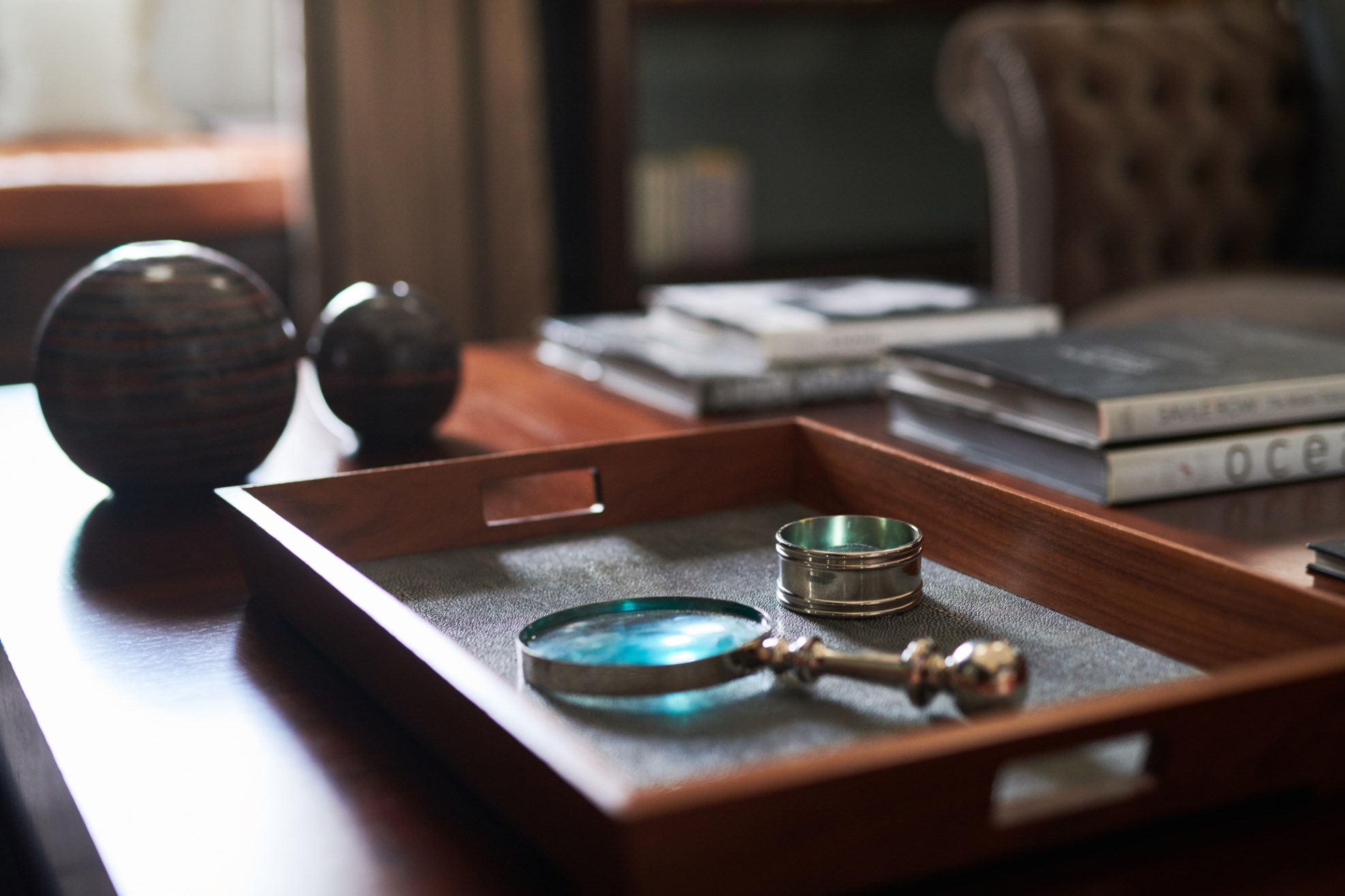 Writer's Penthouse magnifying glass in wooden tray