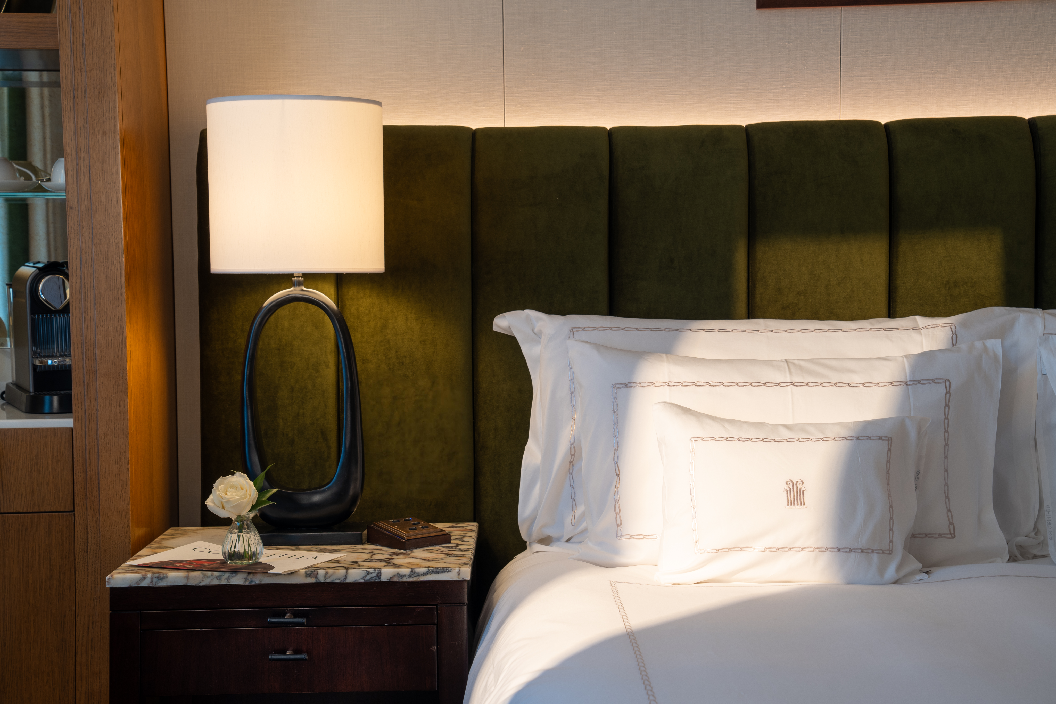 The sun shining within a luxury suite bedroom at Corinthia London