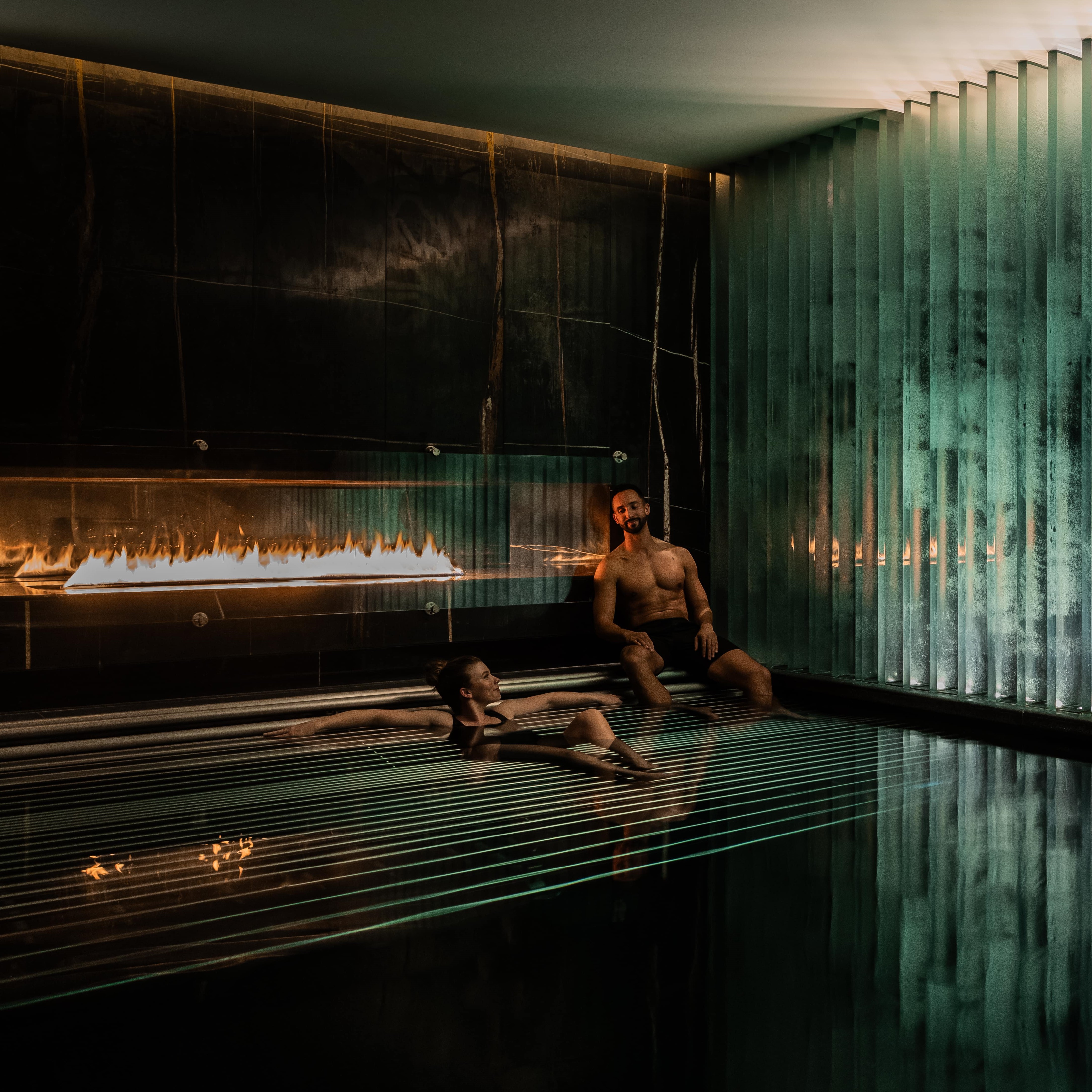 Guests relaxing in the thermal spa facilities, featuring swimming and vitality pools at Biome by Corinthia London luxury hotel near Trafalgar Square