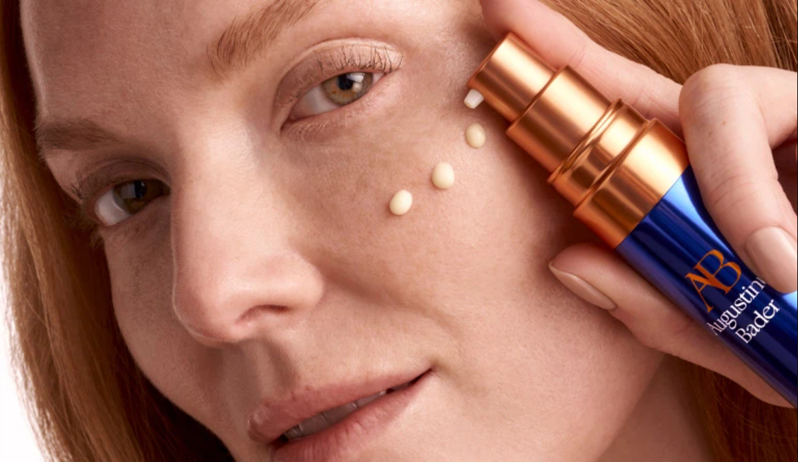 Guest using Augustinus Bader luxury skincare products for glowing, healthy skin at ESPA Life at Corinthia spa near Westminster, London