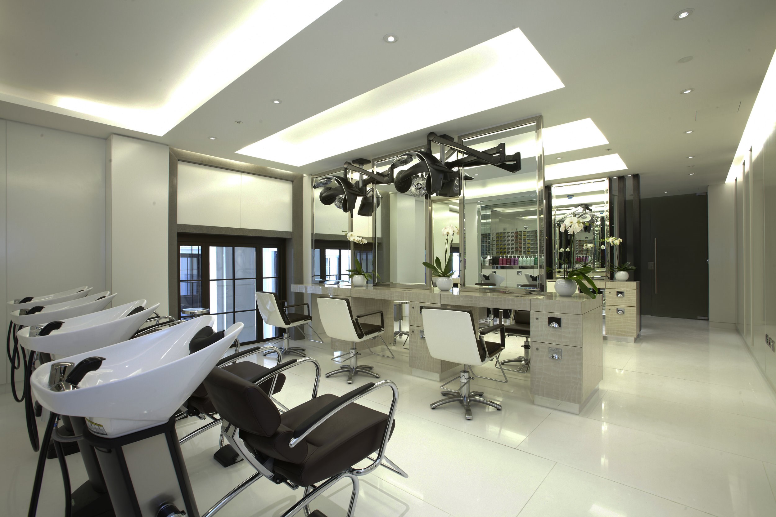 Spacious Daniel Galvin Hair Salon featuring comfortable seating and hair washing sinks within ESPA Life at Corinthia luxury hotel spa near Trafalgar Square, London