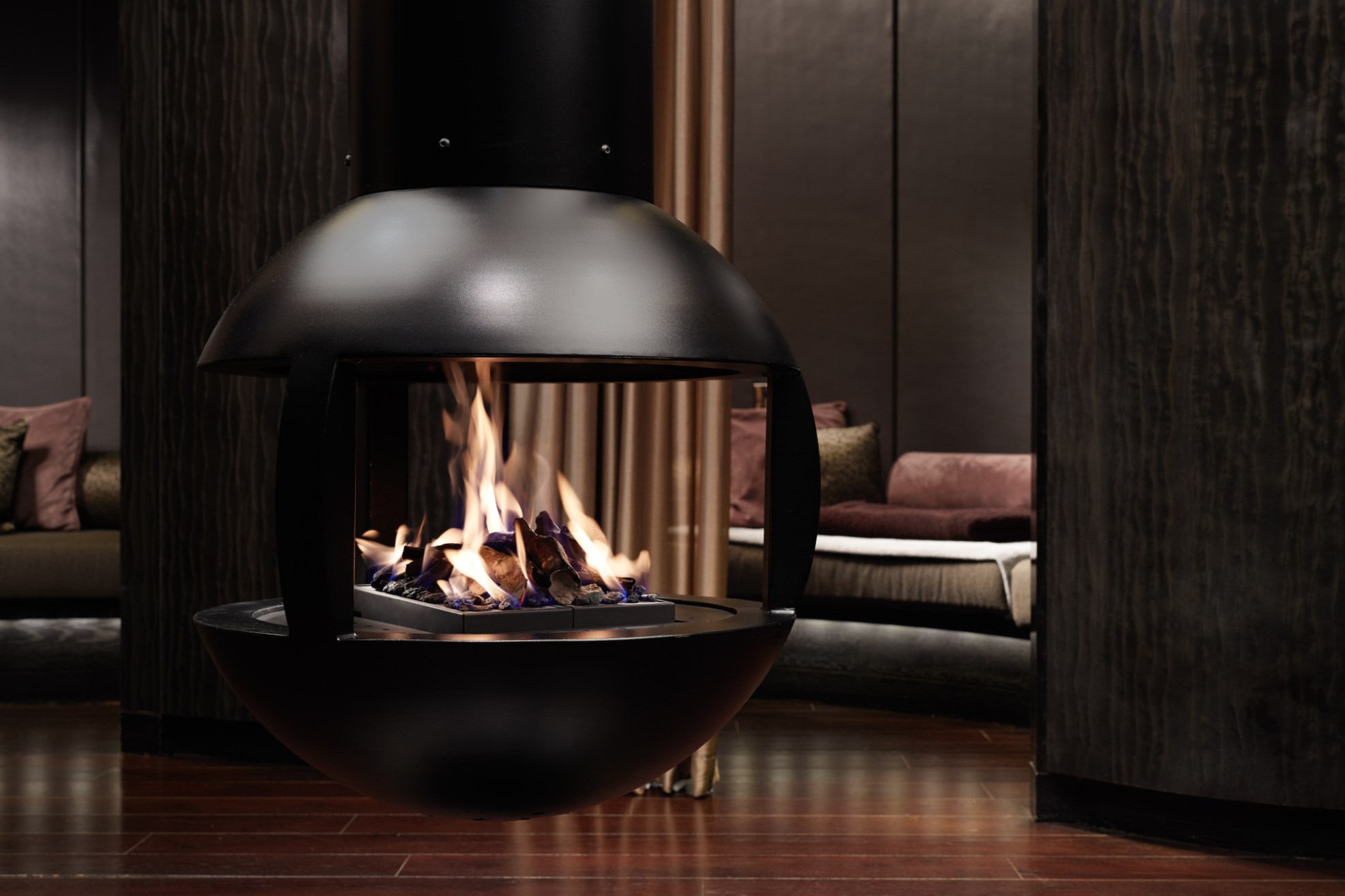 Detail of warm fireplace and sleep pod setup in the luxury thermal floor wellness area at ESPA Life at Corinthia London