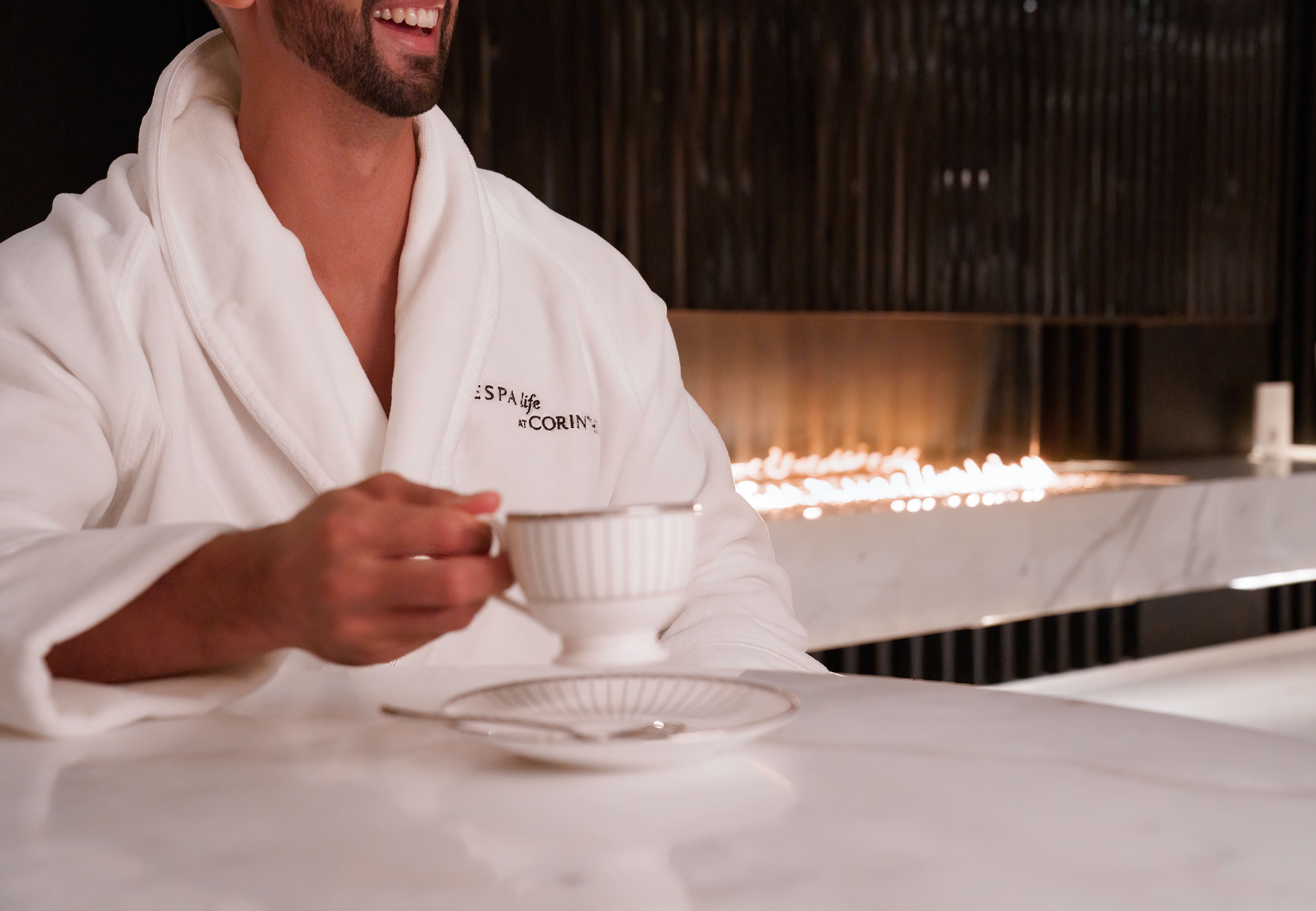 Relaxing moment with guest enjoying tea in the ESPA Life spa lounge at Corinthia London luxury hotel in Westminster