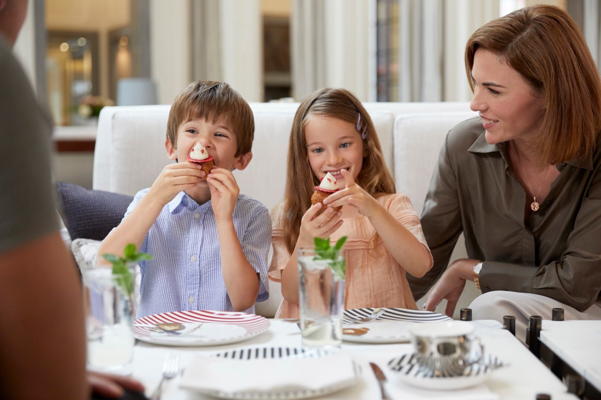 corinthia-family-children-afternoon-tea-eating-cakes